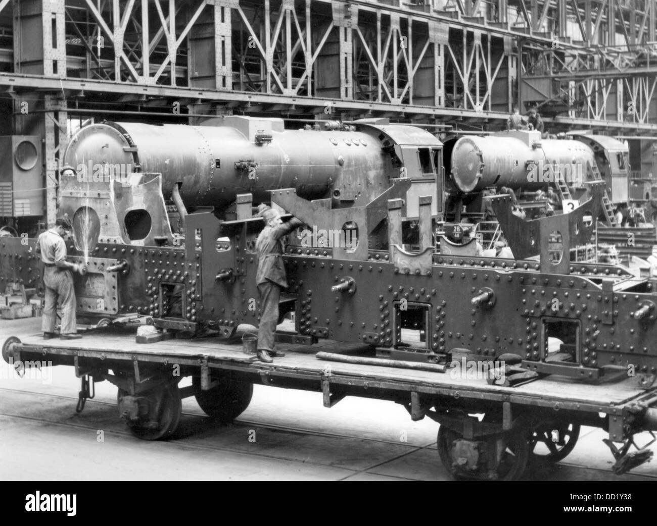 View of the production of a war locomotive series 52 at the Berliner Maschinenbau AG in Wildau, Germany, in August 1943. The construction of a locomotive well-suited for the employment in war should ensure adequate supplying of the territories in the East occupied by the German Wehrmacht. Photo: Bildarchiv der Eisenbahnstiftung/RVM (minimum fee 60 euros) Stock Photo