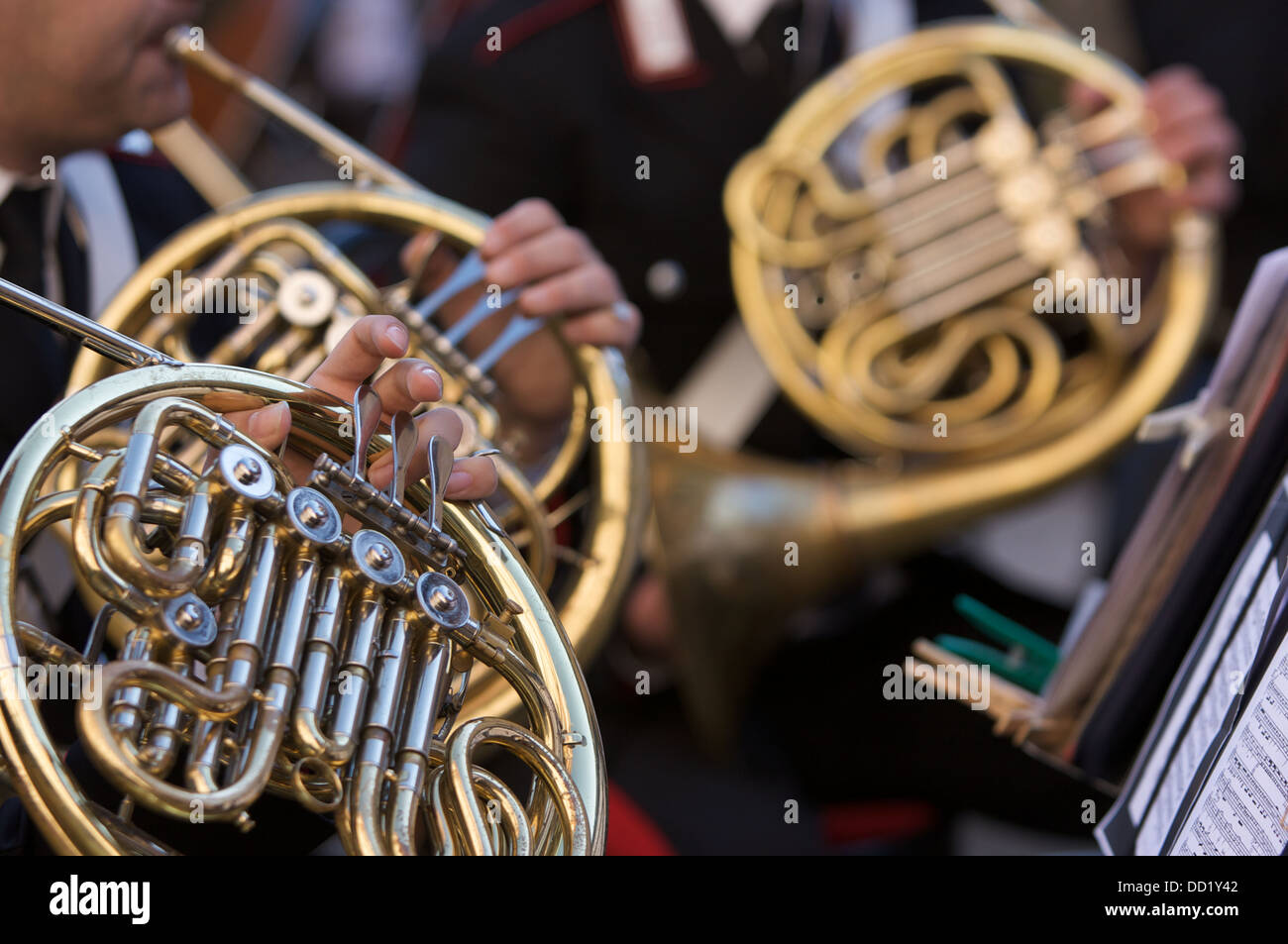 Detail of brass band instruments, with three French horns Stock Photo ...