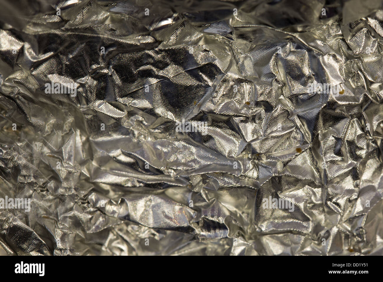 Abstract crumpled tin foil, closeup background texture Stock Photo Alamy