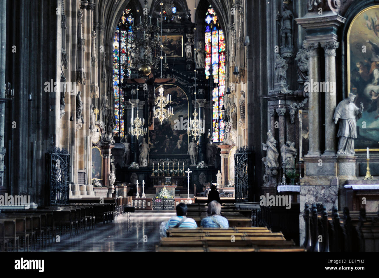 Tourists inside St. Stephen's Cathedral in Vienna Austria Stock Photo