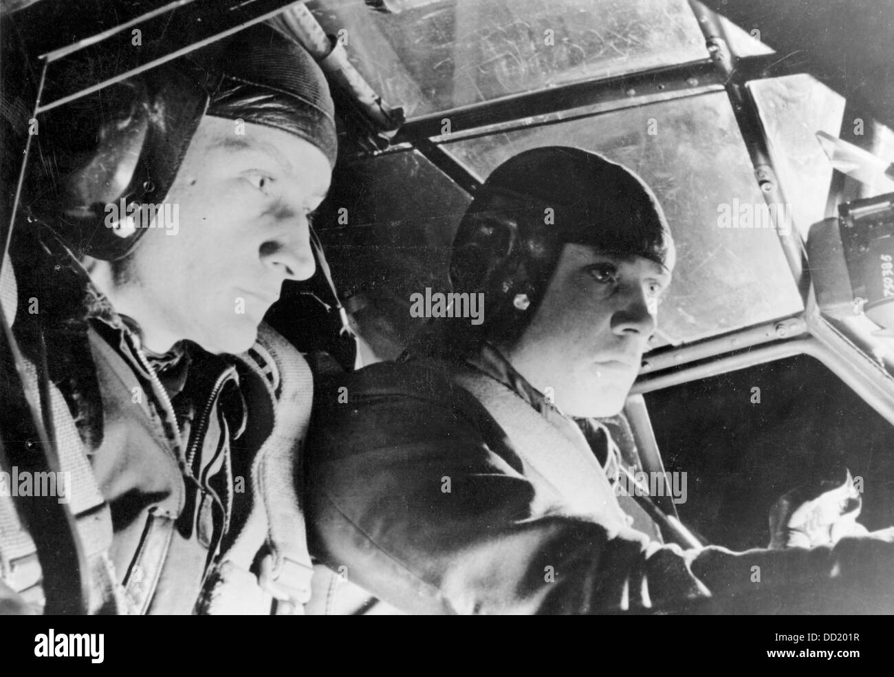 The image from the Nazi Propaganda! shows two pilots during a night operation in the cockpit of their fighter jet in March 1944. Place unknown. Fotoarchiv für Zeitgeschichte Stock Photo