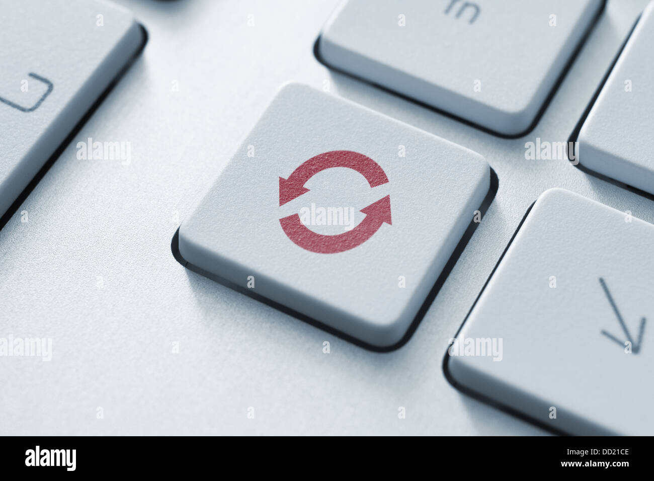 Button with update or synchronize icon on a modern computer keyboard. Stock Photo
