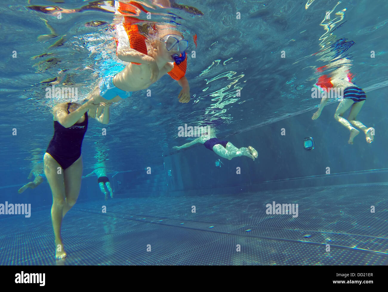 People swim in a public swimming pool in Hamburg, Germany, 22 August