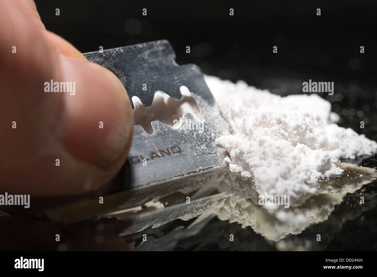 Drug addiction lines rows of powdered cocaine ready to be snorted representing a bad drug habit out of control life destroying Stock Photo