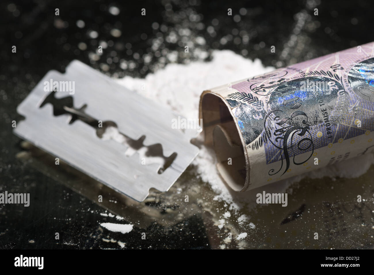 Drug addiction lines rows of powdered cocaine ready to be snorted representing a bad drug habit out of control life destroying Stock Photo