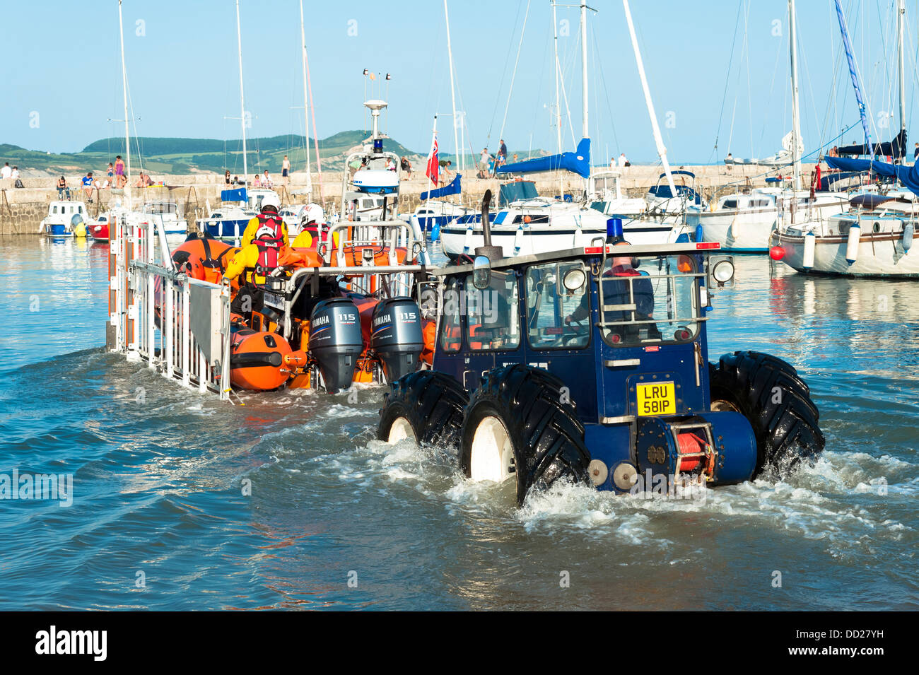 RNLI lifeboat launching on a training exercise at Lyme Regis harbour, Dorset, UK. Inshore inflatable rib lifeboat launch. Stock Photo