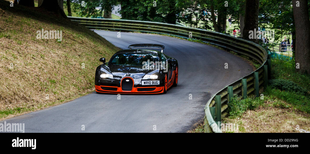 A orange and black Bugatti Veyron Super Sport on the track at Prescott Hill, Gloucestershire, England Stock Photo