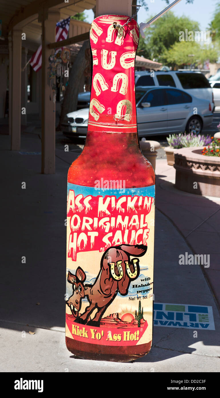 Cardboard cutout for Ass Kickin' Original Hot Sauce outside store in the 5th Avenue Shopping District, Scottsdale, Arizona, USA Stock Photo
