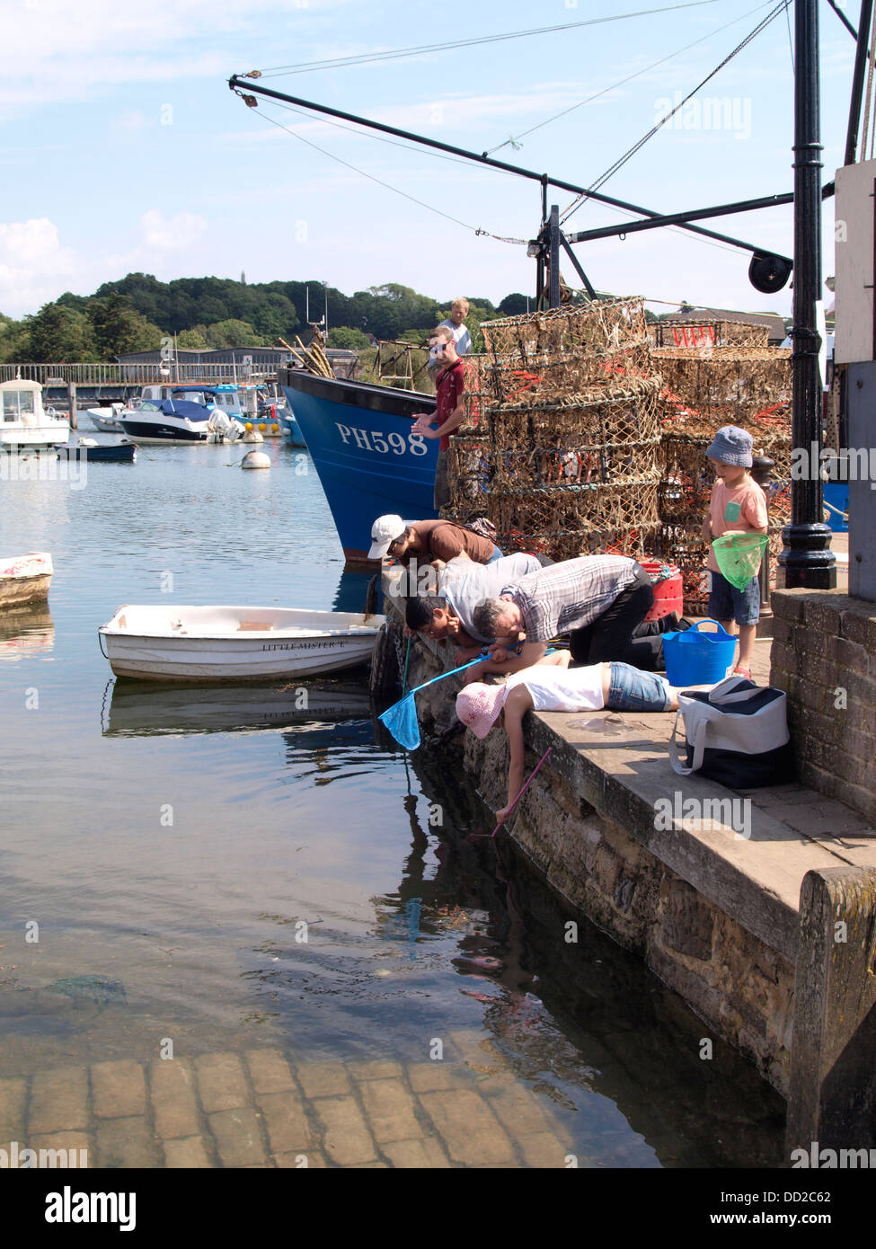 Crab fishing, Lymington Harbour, Hampshire, UK 2013 Stock Photo