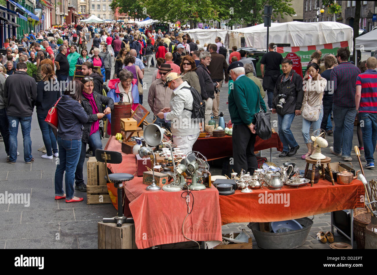Tourists and locals mingle during the annual Grassmarket Fair held every August in Edinburgh. Stock Photo