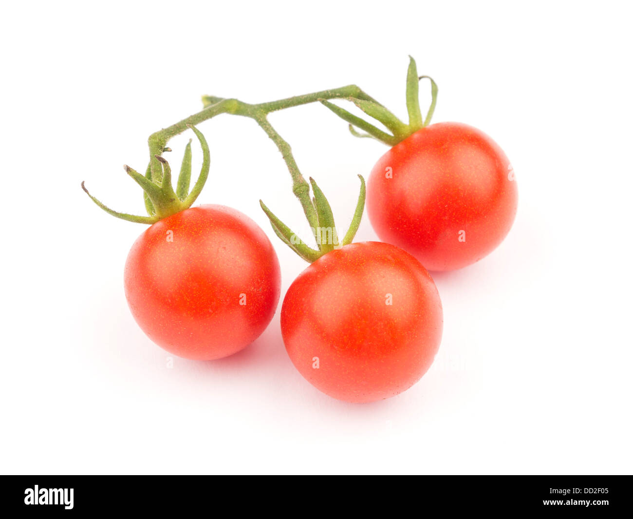 Fresh cherry tomatoes cut out isolated on white background Stock Photo