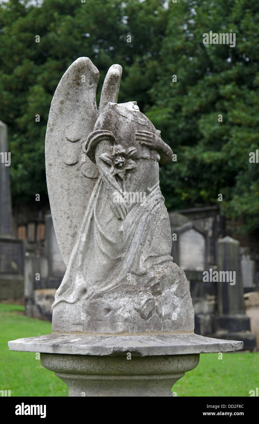 Damaged figure of an angel in New Calton Burial Ground, Edinburgh, Scotland, UK. Stock Photo