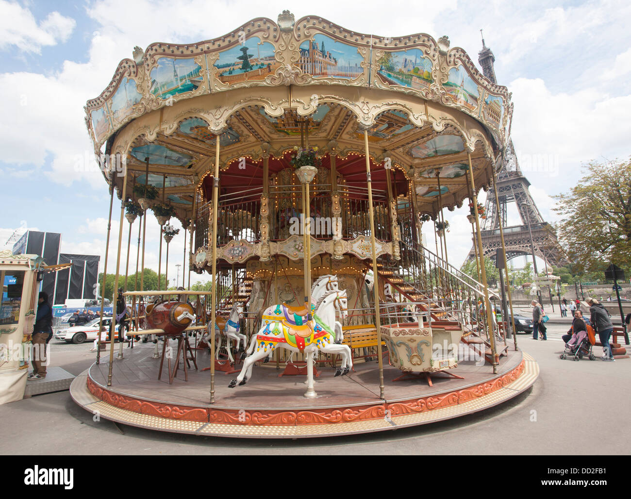 Old Fashioned French style Carousel near the Eiffel Tower in Paris France, also called a Merry-go-Round. Stock Photo