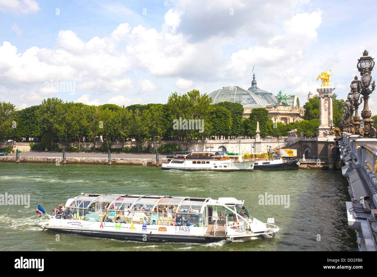 Bateaux Mouches - open excursion boats provide visitors to Paris, France with a view of the city from along the river Seine Stock Photo