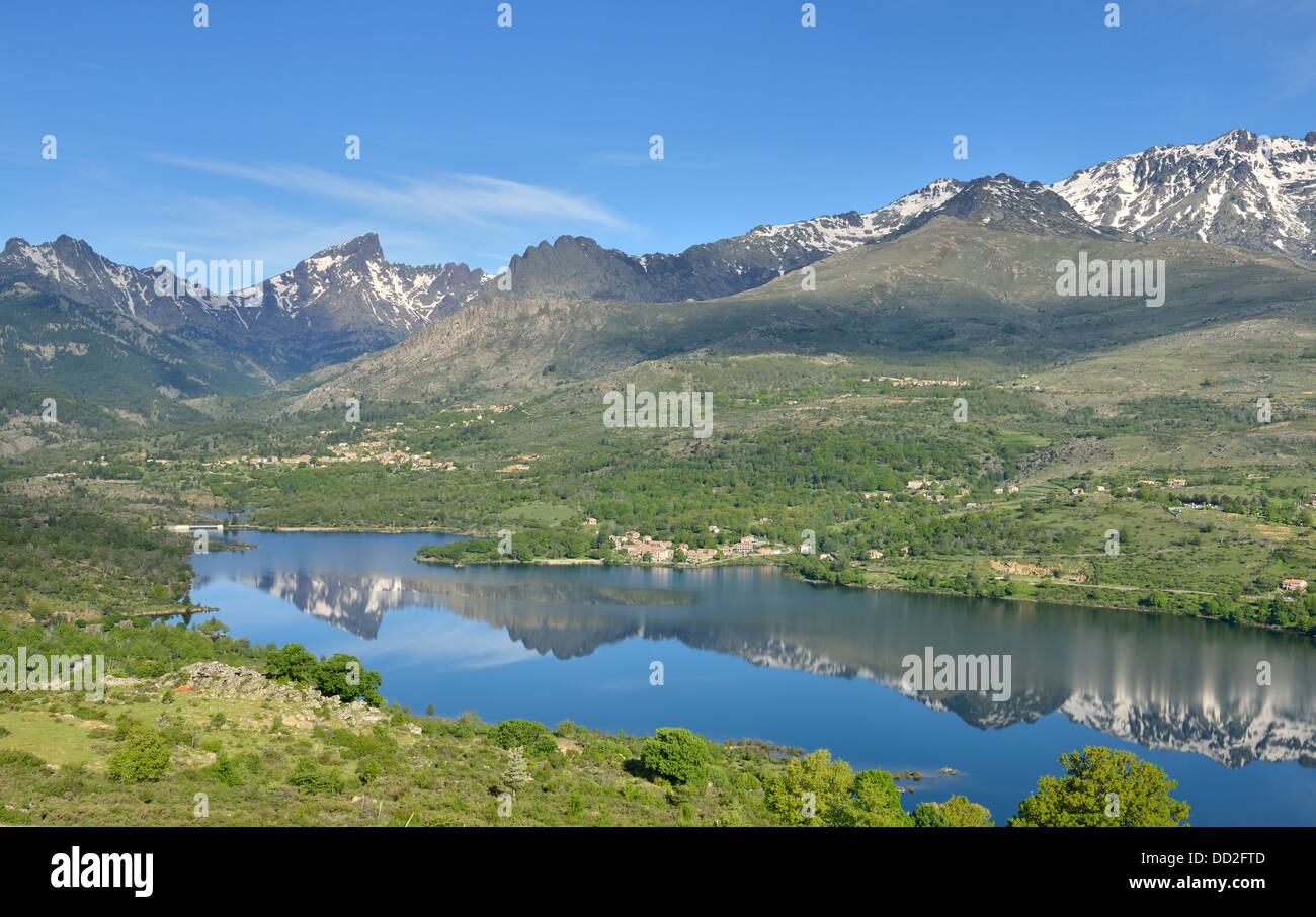 Artificial reservoir in Calacuccia with Paglia Orba and Cinque Frati peaks, Niolo Valley, Central Mountains, Corsica, France Stock Photo