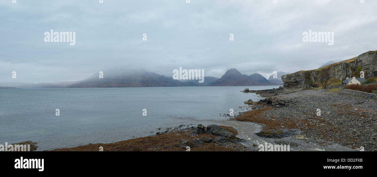 A foggy day in by Loch Scavaig in Skye, Scotland. The Cuillins can be seen shrouded in fog in the distance. Stock Photo