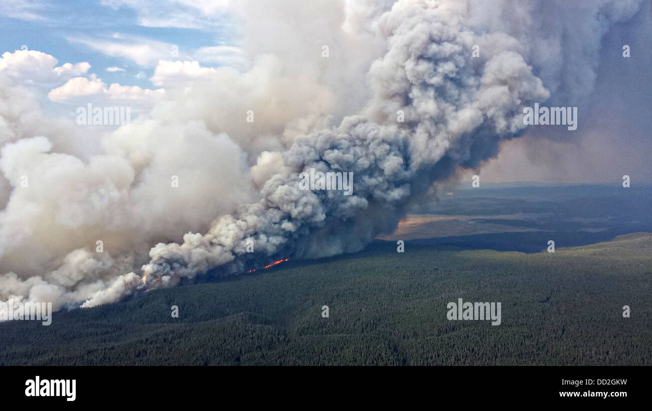 Aerial view of smoke and flames from the Druid Complex wildfire August 17, 2013 in Yellowstone National Park, MT. The wild fires started by lightening strikes have not closed the park to visitors. Stock Photo