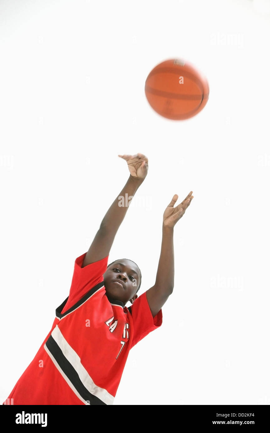 Teenage Boy Wearing Red Jersey And Shooting Basketball; Portland