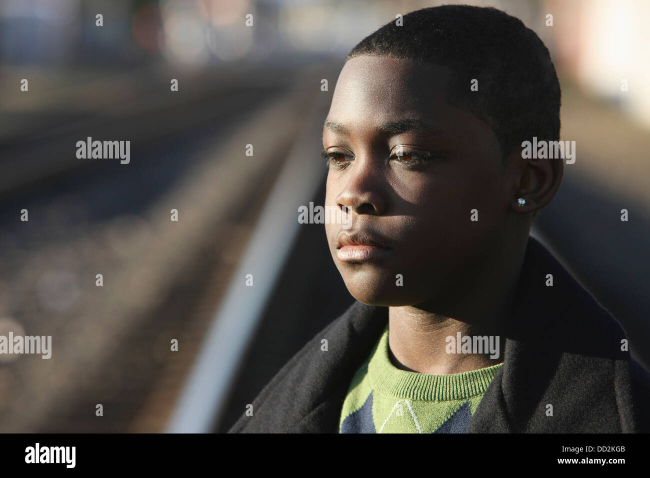 Portrait Of Teenage Boy By Train Tracks; Portland, Oregon, United States of America Stock Photo