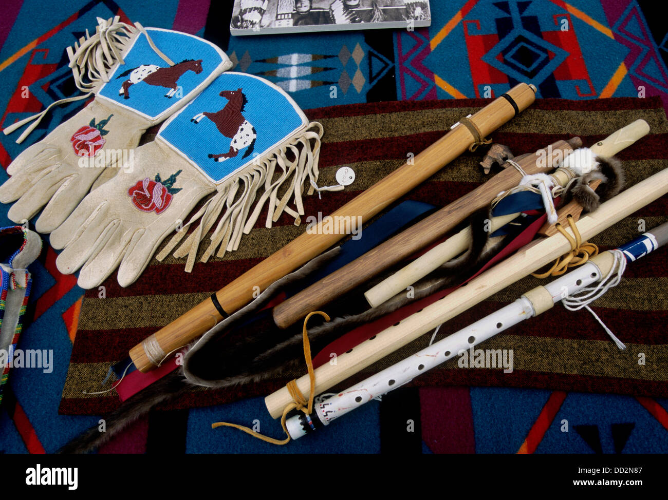 Nez Perce crafts (flutes, beaded gloves, blanket) Stock Photo