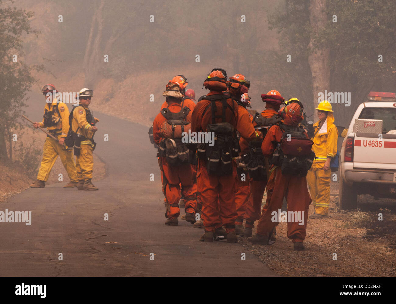 Buck Meadows, CA, USA. 23rd Aug, 2013. A Cal Fire hand crew waits along
