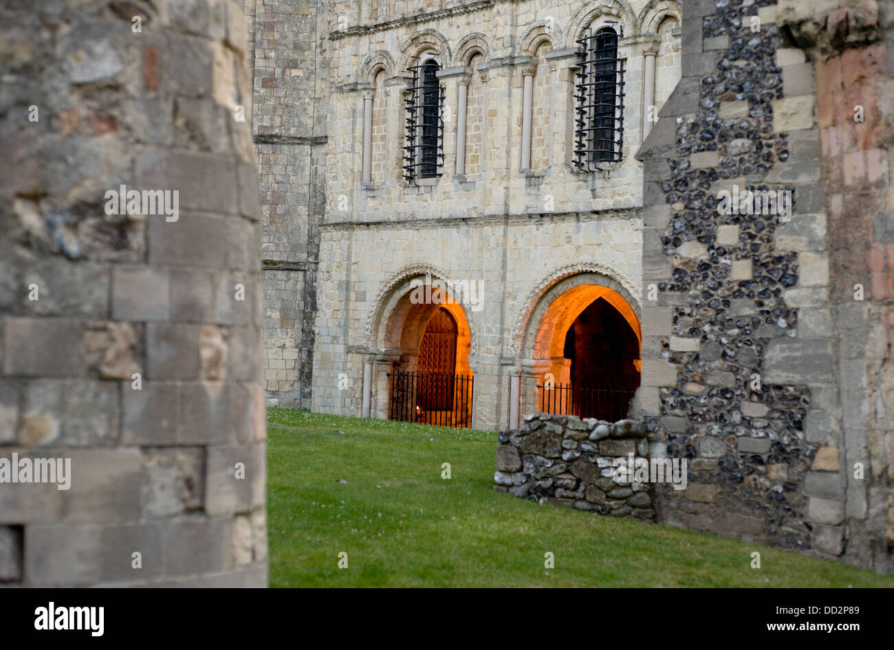 Glowing arched entryways into Canterbury Cathedral ,part of a world heritage site. Stock Photo