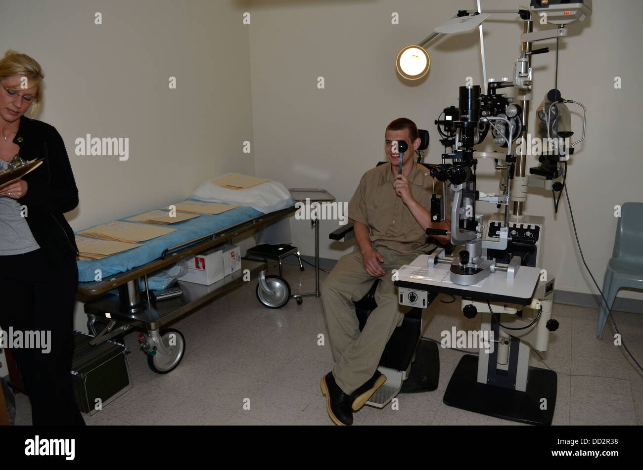 Eye exam of inmate inside American maximum security prison. Medical care are provided to inmates inside or outside the prison. Stock Photo