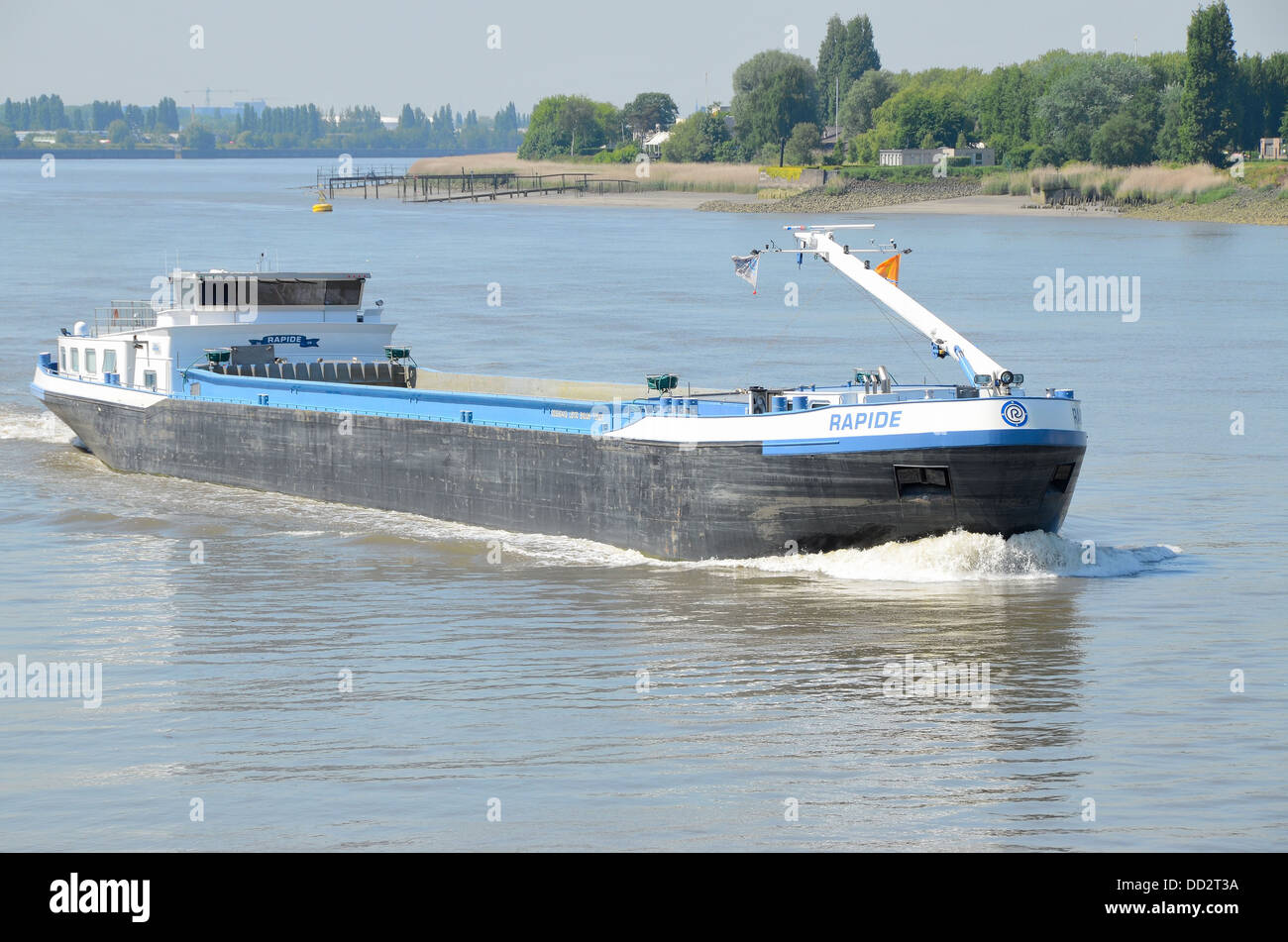 Navigatable A ship navigate on the river Stock Photo - Alamy
