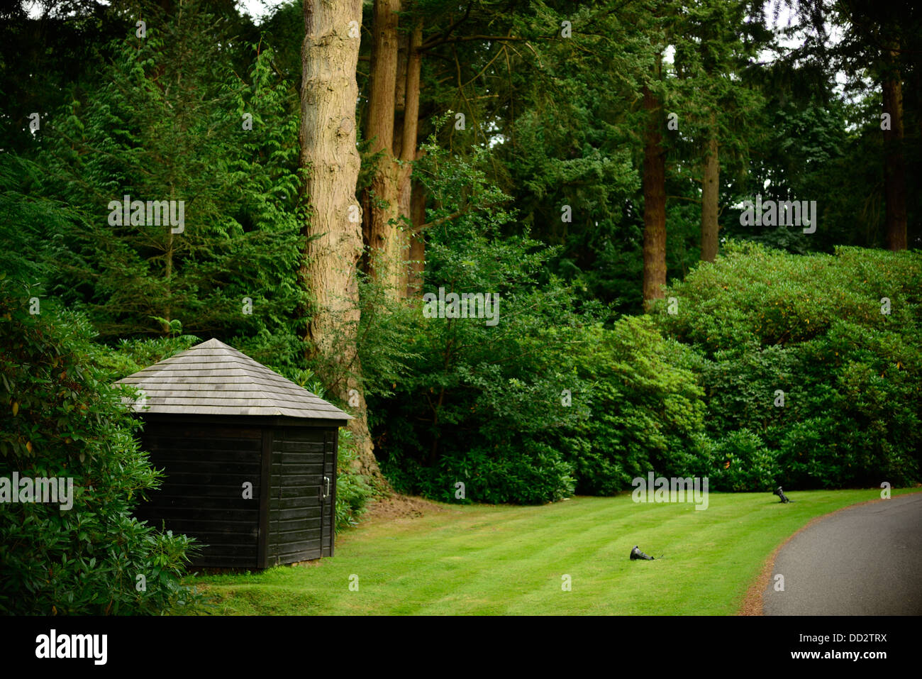 A small hut on the drive of a stately home Stock Photo