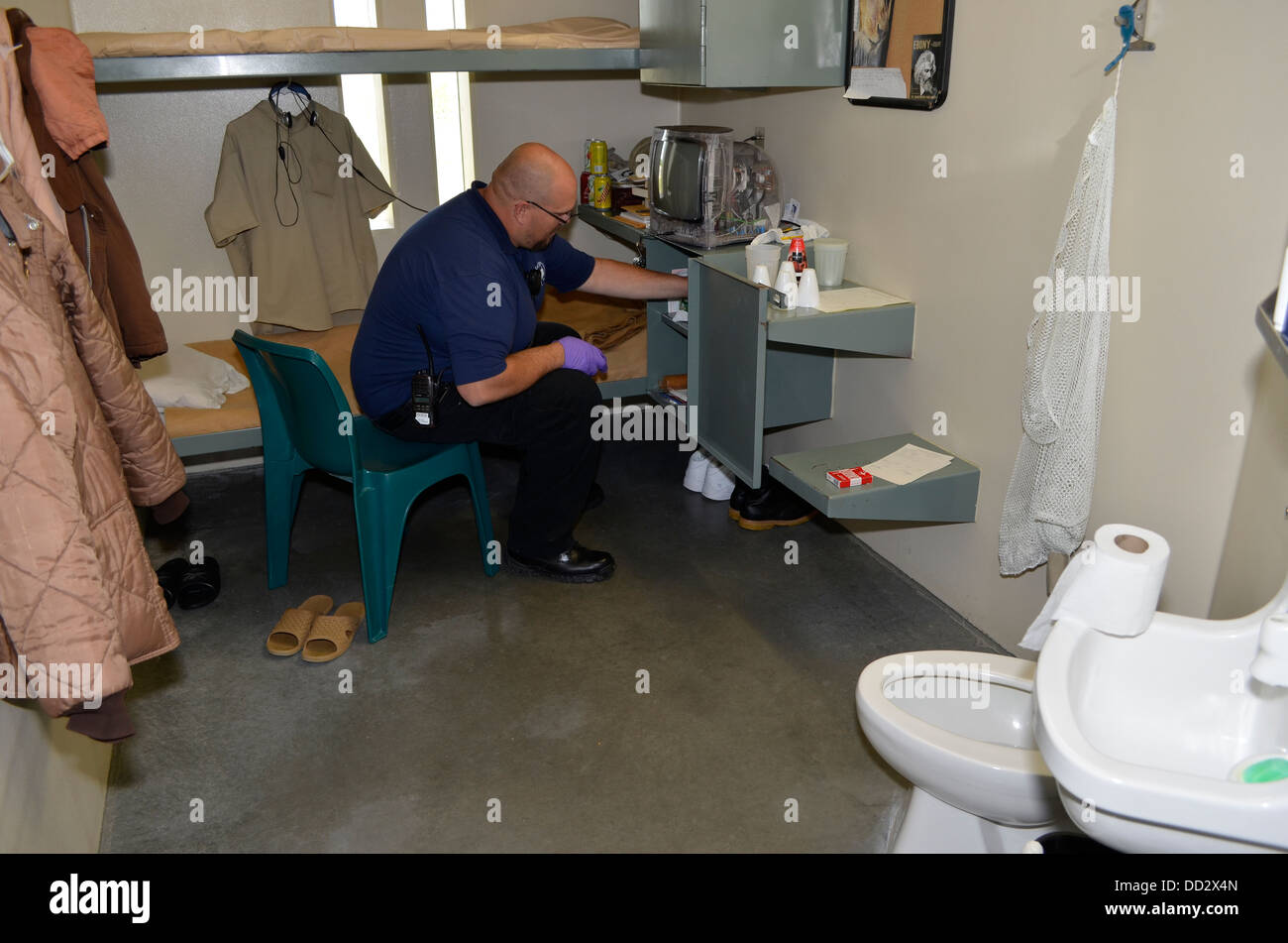 Unit staff conducting a cell search in a maximum security prison in Lincoln, Nebraska. Maintaining high security. Stock Photo