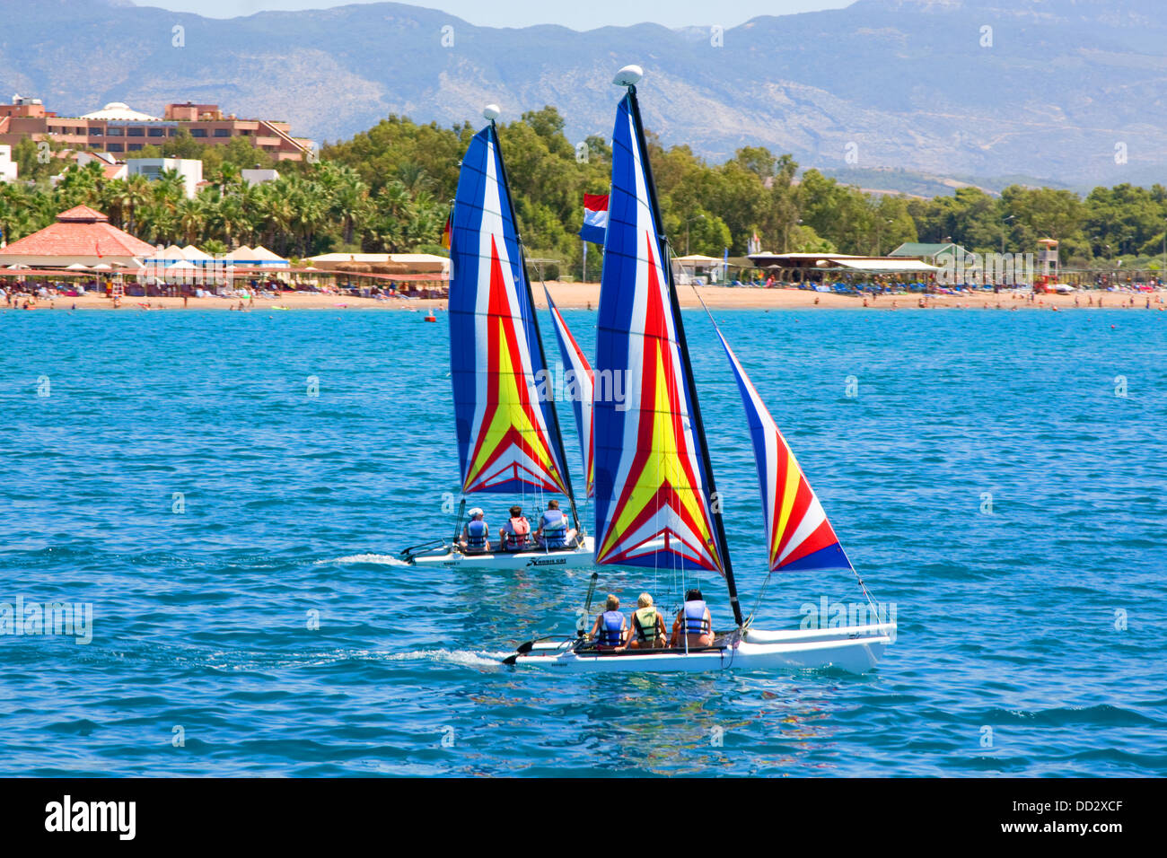 Two brightly colored boats racing on the sea Stock Photo - Alamy