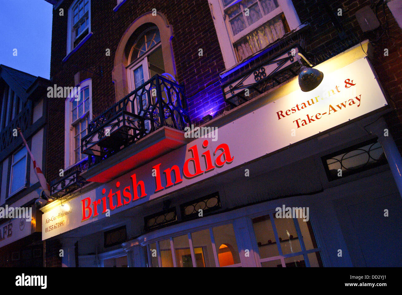 Floodlit facade of 'British India' Indian restaurant, Connaught Avenue, Frinton-on Sea, Essex, England Stock Photo