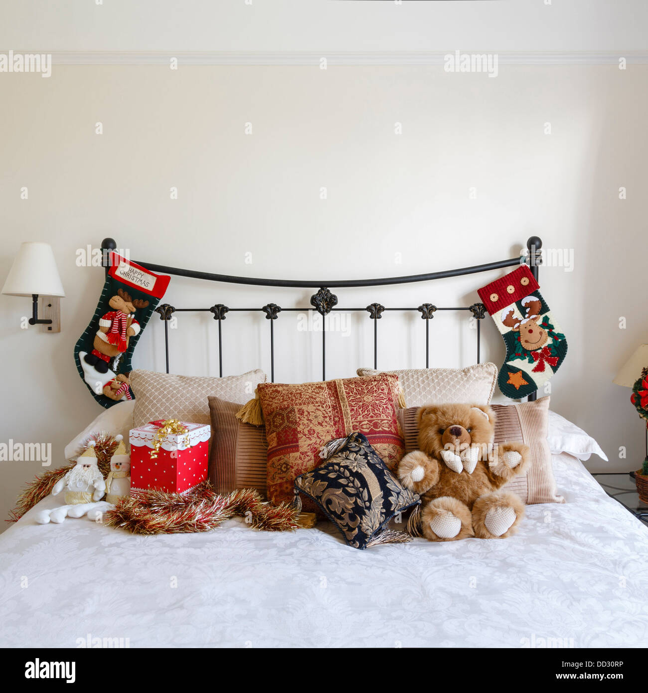 Cozy bedroom with Christmas decorations and stockings Stock Photo