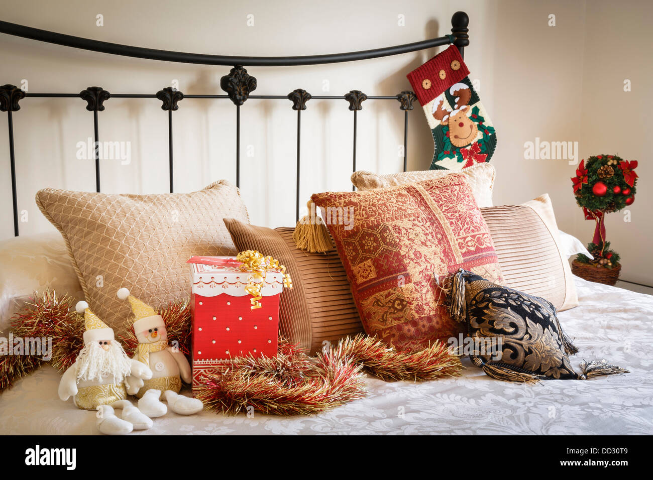 Christmas interior of modern bedroom with wrought iron bed Stock Photo