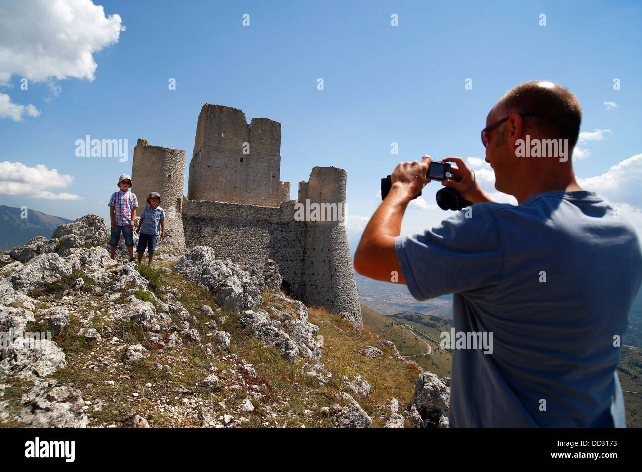 A tourist photographs the medieval castle at Rocca Calascio in Abruzzo, Italy. Stock Photo
