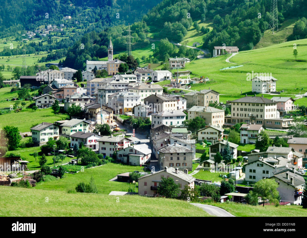 Switzerland - Poschiavo - alpine village - seen from the Bernina Express train - Tirano to St Moritz line - summer sunlight Stock Photo