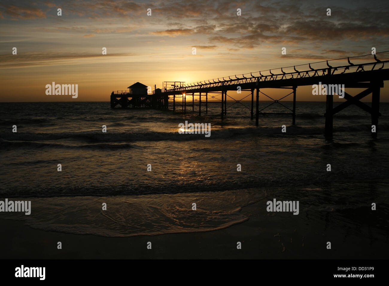 Pier at Totland Bay in the Isle of Wight, southern England at sunset. Shot in the summer of 2010 with a Canon EOS 400D and stand Stock Photo