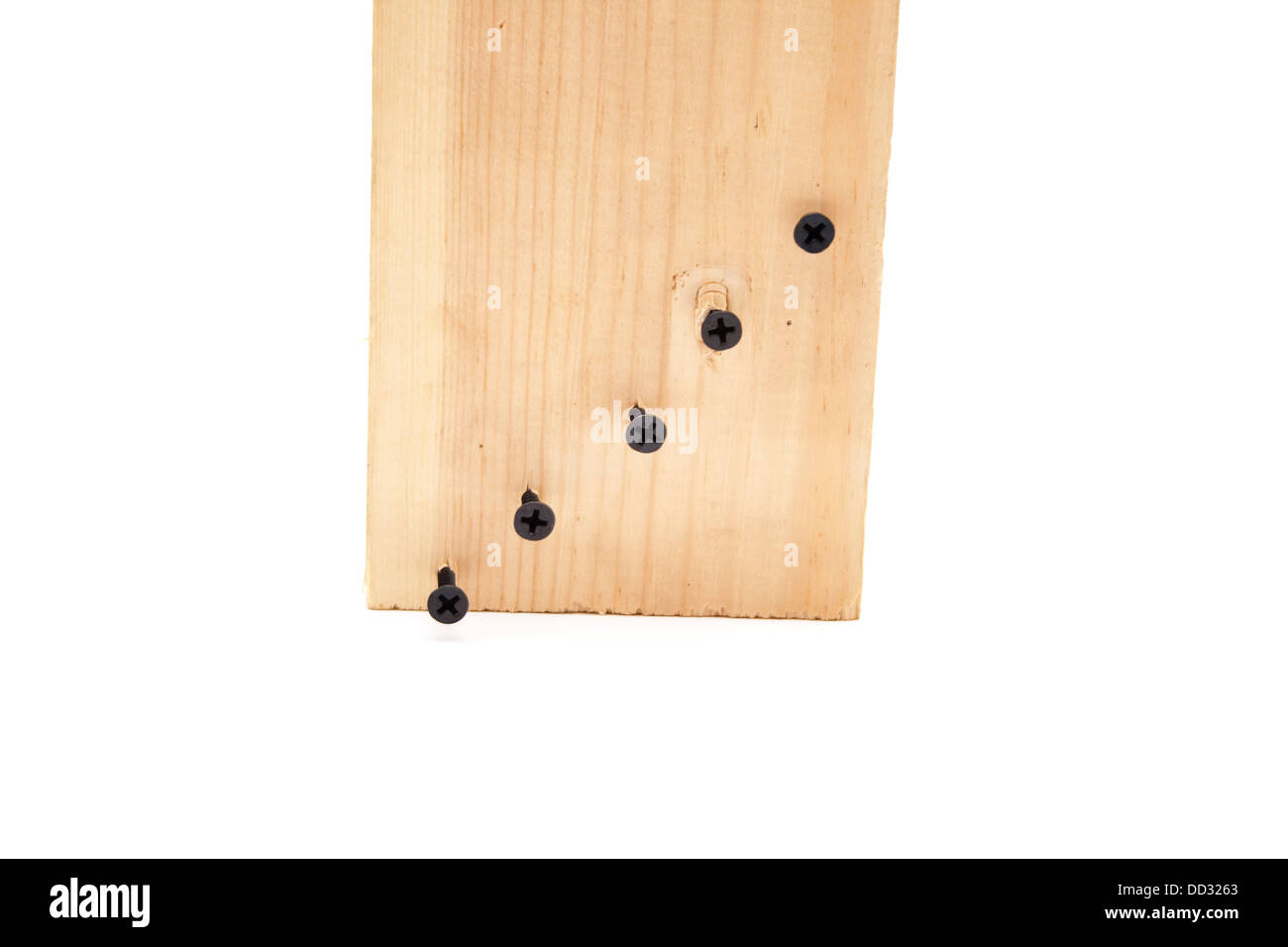 Wooden board with black screws Stock Photo