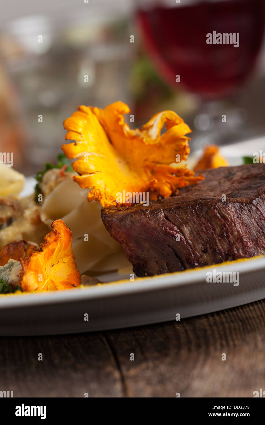 steak with chanterelle mushroom and noodles Stock Photo Alamy