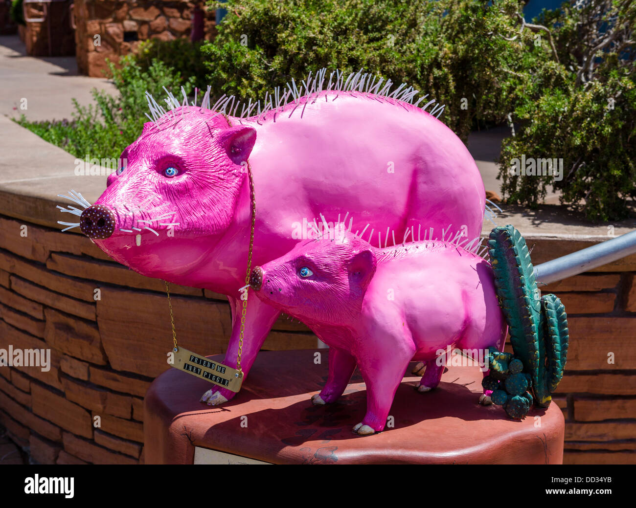Pink pigs outside the Pink Jave Cafe and Pink Jeep Tours on Main Street, Sedona, Arizona, USA Stock Photo