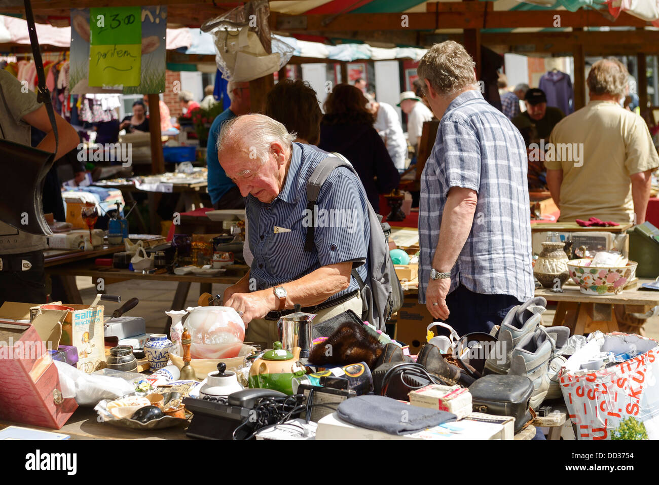 Shoppers visiting the outdoor flea market in Chesterfield town centre Stock Photo