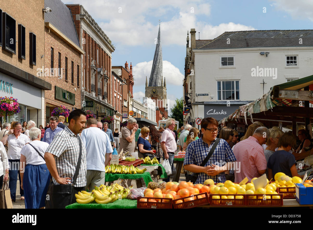 Shoppers visiting the outdoor market in Chesterfield town centre Stock