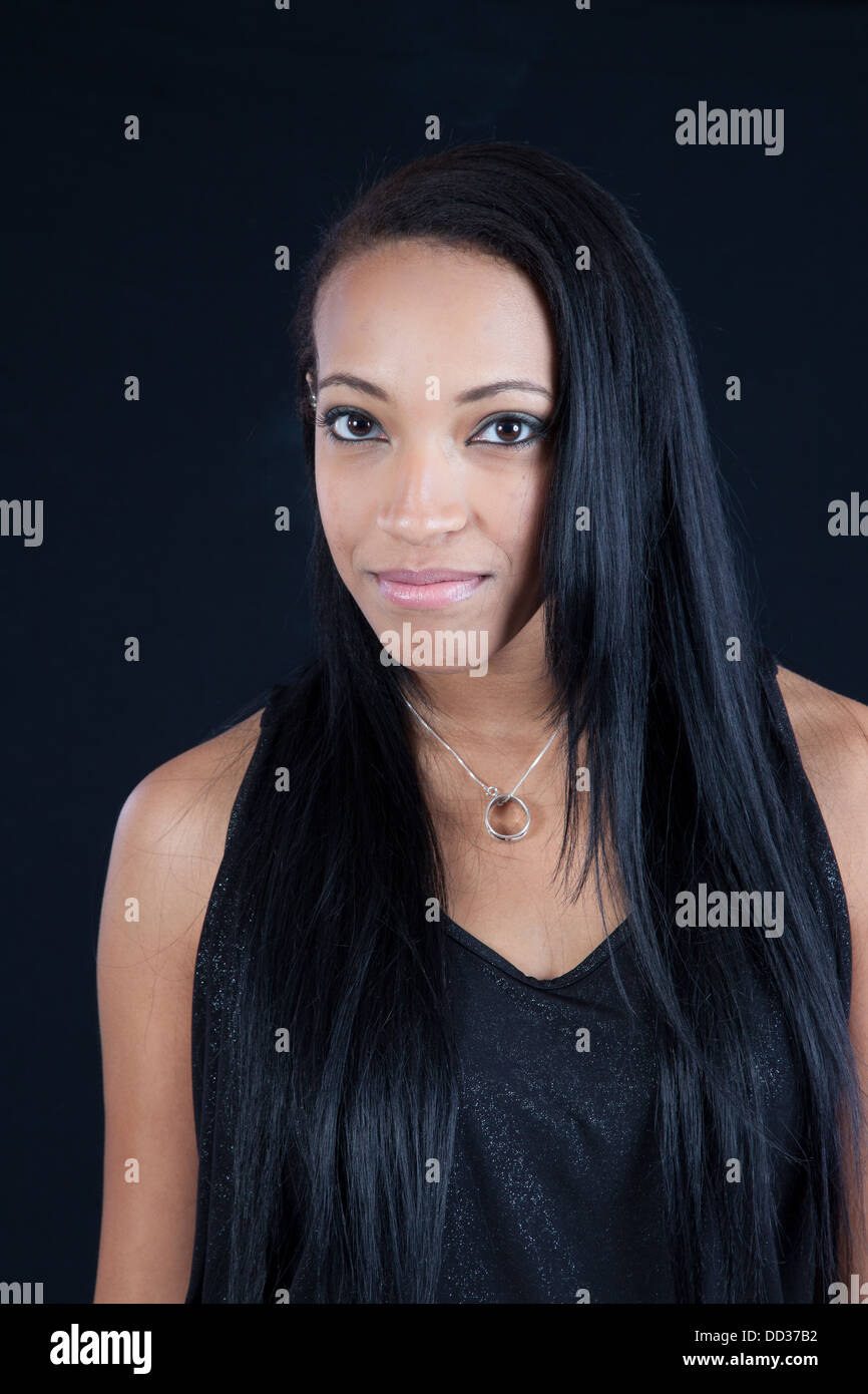 Pretty black woman looking at the camera with a happy, smiling ...