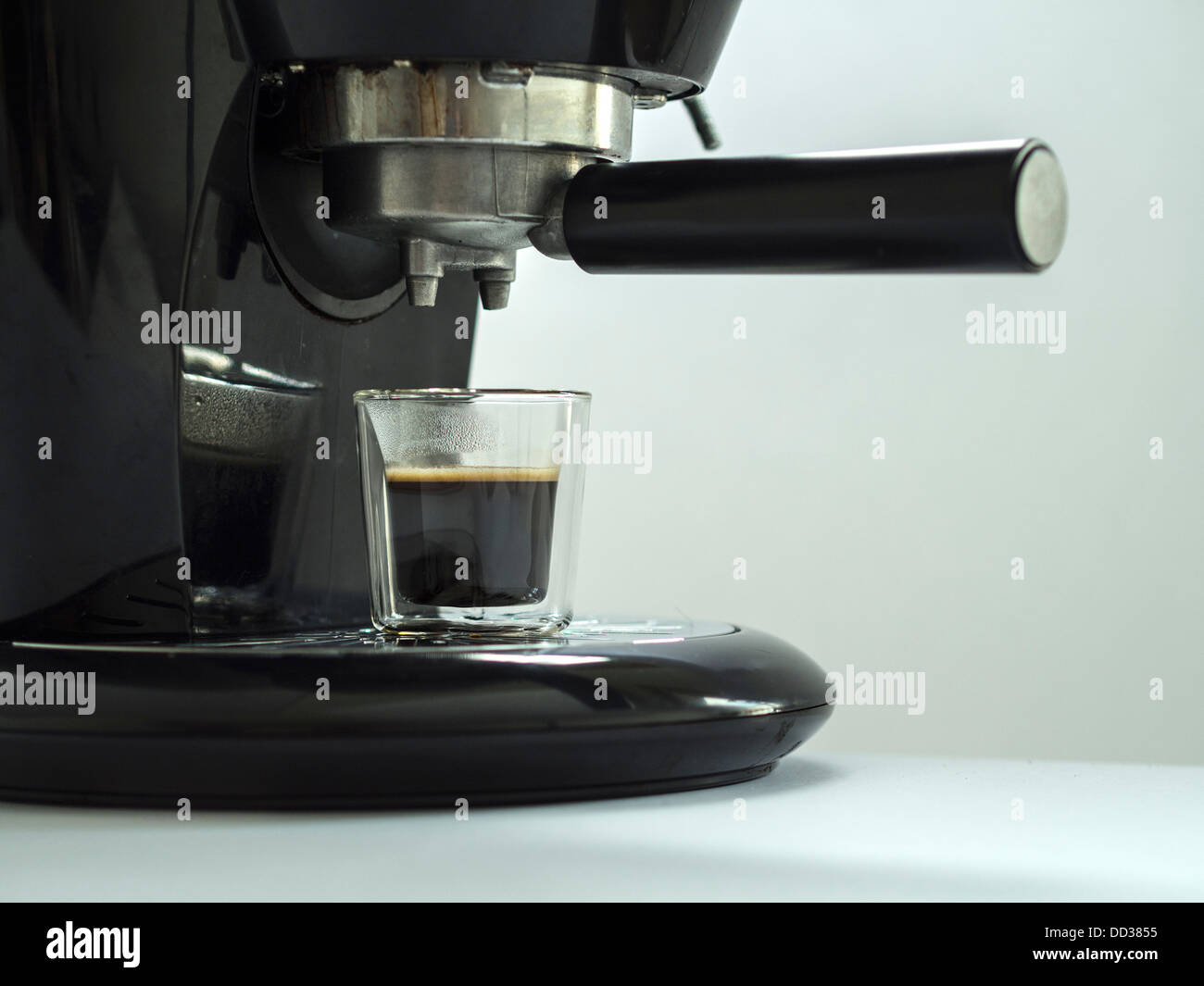 Black electric espresso coffee maker isolated on white background Stock