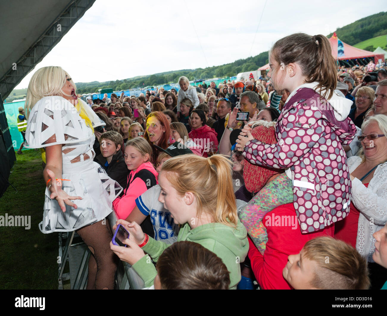 Aberystwyth Wales UK, Saturday 24 August 2013   'Maybe GaGa', a Lady Gaga tribute act, with her fans at The second day of the  2013 Big Tribute Festival, Wales's only music festival devoted to covers bands. August Bank Holiday weekend 2013  photo Credit:  keith  morris/Alamy Live News Stock Photo
