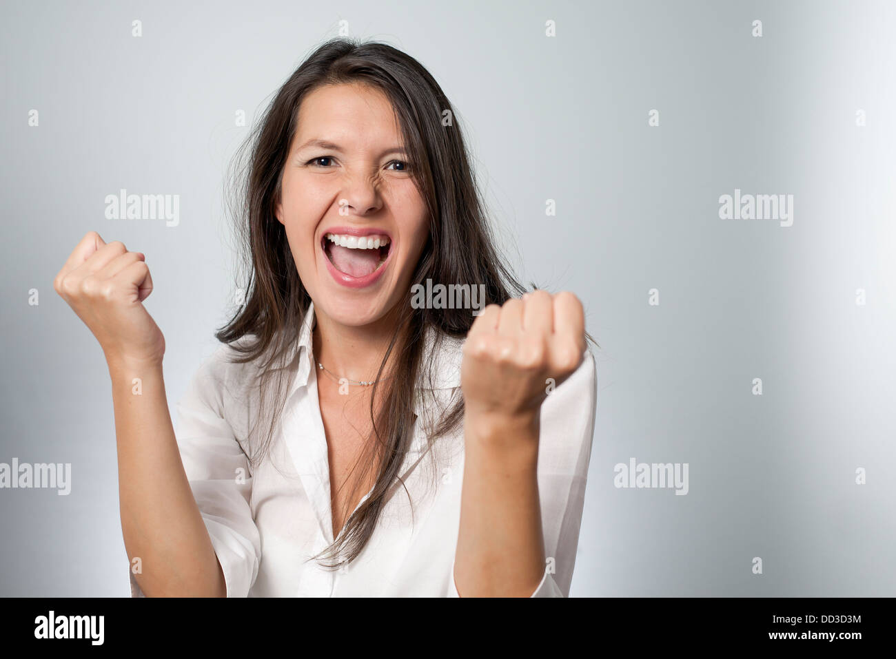Jubilant young woman cheering her success Stock Photo Alamy