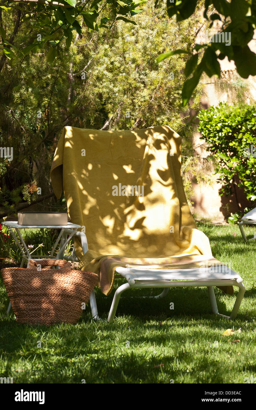 A sun lounger or sunbed in the garden of a Majorcan hotel Stock Photo