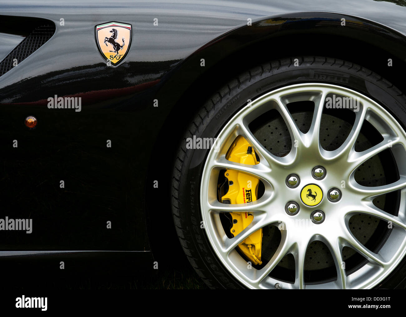 Black Ferrari car side. Ferrari badge horse logo Stock Photo