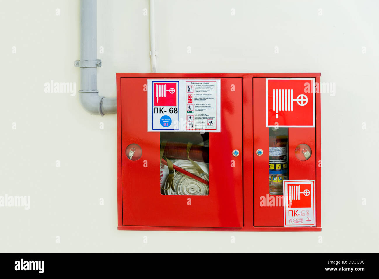 Fire extinguisher installation on a wall Stock Photo