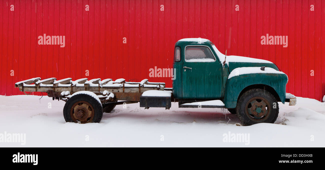 A Vintage Pickup Truck Sits In The Snow; Alberta, Canada Stock Photo